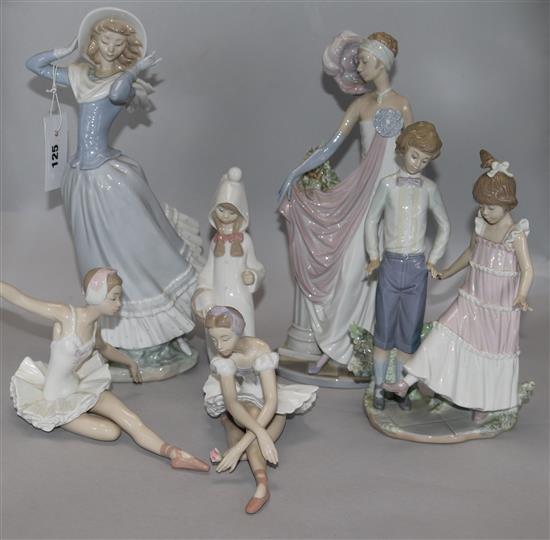 Six Lladro figurines: two large figures, a boy and girl and two ballerinas
